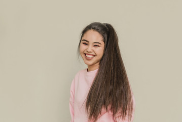 young attractive girl on white background. happy woman smiling. happy teenage girl