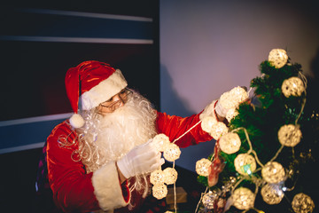 Portrait of santa clause decorate christmas tree in the house,Thailand people,Xmas festival