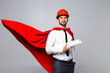 Young architect with blank and hemlet looks like superhero isolated on white background