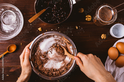 Fotomural Top view female hands mix cocoa powder