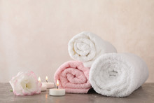 Towels, Candles And Flower On Grey Background, Space For Text