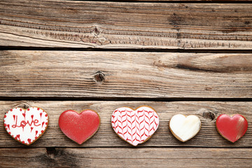 Wall Mural - Valentine day heart shaped cookies on brown wooden table