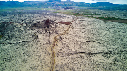 Amazing aerial lunar landscape on the Snaefellsnes peninsula in Iceland. Sci-fi landscape on earth with terracotta colors and lava covered by gray moss. Unique places. Jules Verne