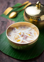 Wall Mural - Bua loi,Colorful rainbow Thai glutinous rice balls with coconut milk on wood,Thai dessert