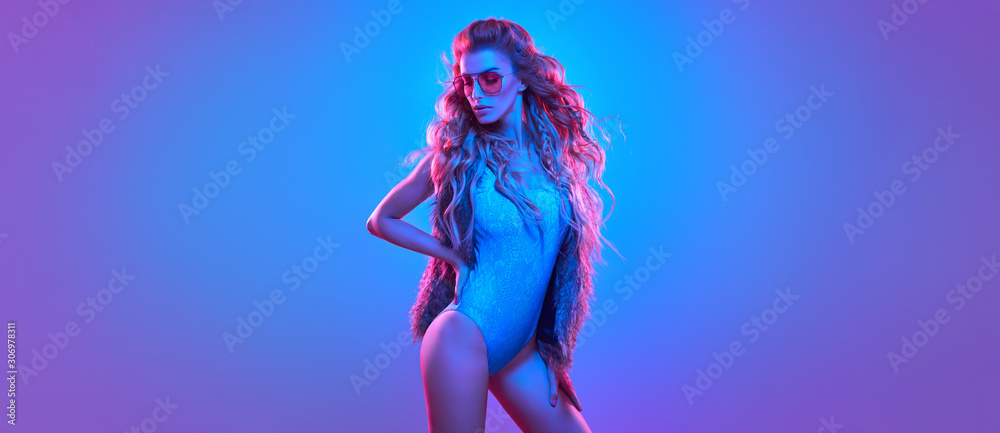 Fashionable glamour beautiful woman with Trendy wavy neon light hairstyle. Party night club vibes, gel filter. Excited shapely sexy girl. Bright pink blue lighting. Art fashion creative neon color. - obrazy, fototapety, plakaty 
