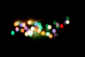 blur light bokeh color red green yellow on background black.