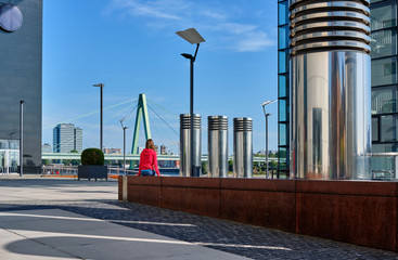 Wall Mural - Tourist in Cologne near Kranhaus building complex with crane house on riverside of Rhein in Cologne, Germany.