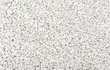 Seamless plain white gravel texture background from above.