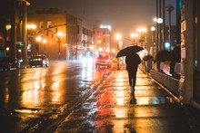 Person In The Rainy City At Night St. Johns, Newfoundland, Canada