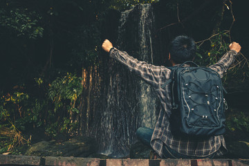 Men tourists walk in the forest nature in tranquil scene.