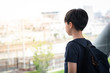 © myboys.me - Portrait, Good looking Asian tween student boy stand alone, isolated, lost in thought on walkway at school. Bullying, Teen problems, Physical and emotional abuse, Loneliness, Withdrawn, Introvert.