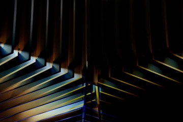 Poster - Modern architecture or minimal interior fragment with wooden lath structure. Angular geometric background. Irregular grid pattern glowing in darkness.