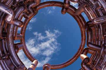 Wall Mural - pipes, tunnel with old and rusty metal tubes with sky in the background