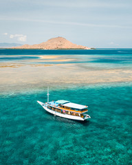 Wall Mural - aerial view of boat on the beach