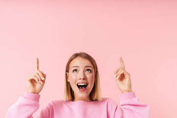 Poster - Portrait of alluring woman smiling and pointing fingers upward