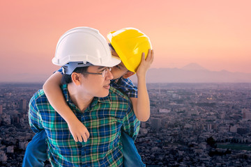 Wall Mural - Father builder is carrying his son in Tokyo Fuji  city and family boding future concept in Japan