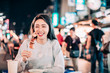 © Tom Wang - Asian young woman enjoy  street food in  Night Market