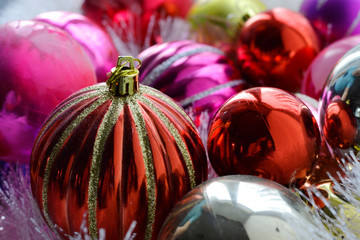 Christmas colorful shiny Cristmas balls with shimmering garland and fluffy decor