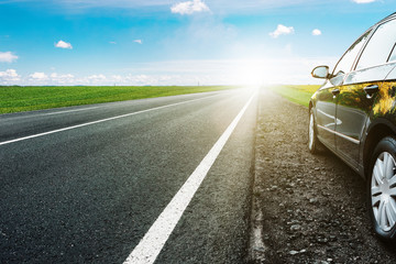 Wall Mural - black car on asphalt road