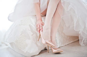 Poster - Elegant white wedding shoes at bride morning.