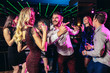 Young people dancing in night club