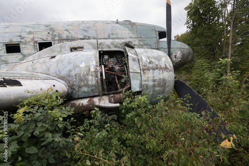 Cuadros en Lienzo Damaged Douglas C-47b Dakota military airplane at abandoned military airfield Ze