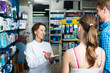 © JackF - Woman pharmacist in drug store