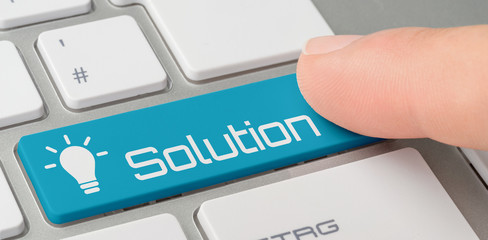 Wall Mural - a keyboard with a blue labeled button - solution