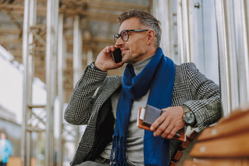 Handsome man talking on cellphone on the street