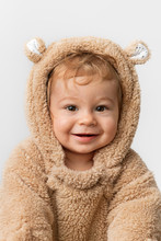 Cute Smiling Baby In Hooded Bear Suit
