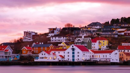 Poster - Kristiansund, Norway. View of city center of Kristiansund, Norway during the cloudy morning at sunrise with colorful sky. Time-lapse of port with historical buildings, panning video