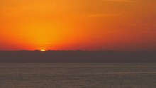 Time Lapse Ocean Sunrise Over Silver Sea With Cloudbank On Horizon