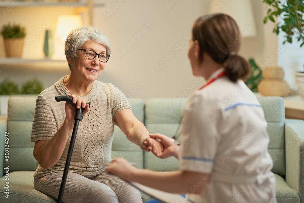 Happy patient and caregiver - obrazy, fototapety, plakaty 