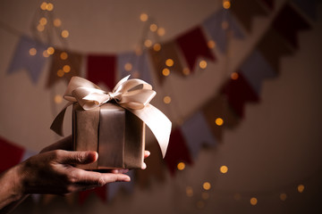 girl holding presents in hands