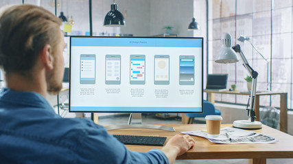 Poster - Young Professional Works on a Personal Computer at His Desk in the Creative Office. Notebook Screen Shows Mobile Phone Application Design, Software UI Development. In Background