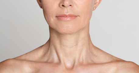 skin care. half face portrait of mature woman