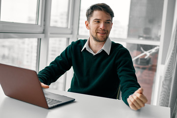 Wall Mural - young businessman working on laptop