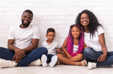 Wall Mural - Portrait of joyful african american family with two little kids