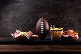 Fototapeta  - chicken wings, fries and onion rings for football on a table. Great for Bowl Game party