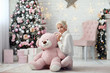 Young beautiful girl with pink bear.