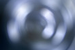 Blurred radial gradient blue gray background. Mixed circular texture