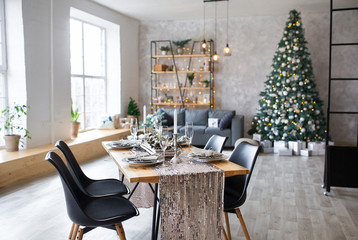 Table setting with holiday decorations. Preparation for christmas dinner