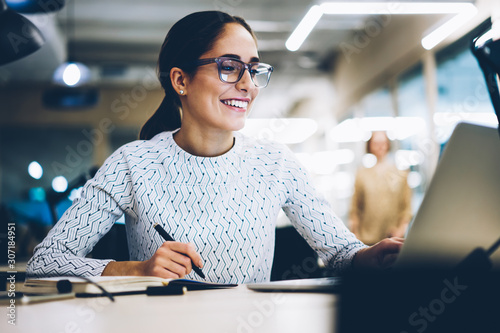 Cuadros en Lienzo Cheerful businesswoman excited with accomplished project successfully monitoring