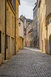 Fototapeta Uliczki - Medieval Street in the city of Dole in the Jura department in the Franche-Comté region in eastern France.