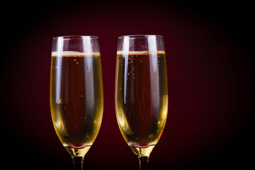 Drink. Two glasses white wine, dark background