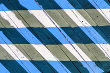 Blue - White Stripes On Planks Of Footbridge. A Wooden Floor On The Outdoor Veranda.
