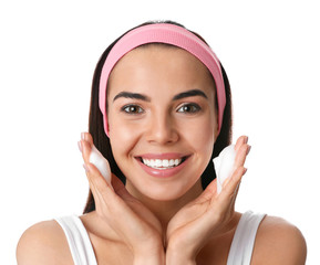 Sticker - Young woman applying cosmetic product on white background. Washing routine