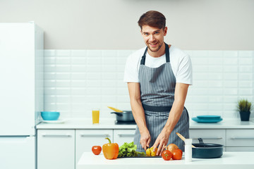 Wall Mural - man preparing food in the kitchen