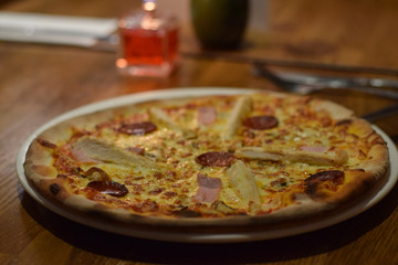 Poster - Chicken and peperoni pizza in the italian resaurant table