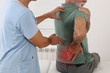Senior man with back pain. Chiropractic pain relief therapy. Spine physical therapist and paient.